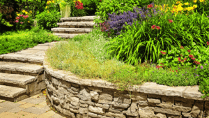 Dry garden with succulents, gravel, river rocks, and a flowing greenery design in a   South Austin backyard landscape.
